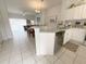 Open concept kitchen with granite countertops and breakfast bar at 8545 Bay Lilly Loop, Kissimmee, FL 34747