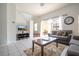 Bright living room with patio access and comfortable seating at 8545 Bay Lilly Loop, Kissimmee, FL 34747