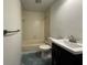 A clean bathroom with a tub, white tile, vanity, and sink at 300 New Waterford Pl # 204, Longwood, FL 32779