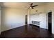 Bright, spacious bedroom featuring dark wood floors, ceiling fan, and a large closet at 300 New Waterford Pl # 204, Longwood, FL 32779