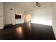 Open concept living space with dark wood floors, a ceiling fan, and neutral walls at 300 New Waterford Pl # 204, Longwood, FL 32779