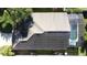 Aerial view showing the roof and screened-in pool area at 3075 Barbados Ln, Haines City, FL 33844