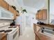 Functional kitchen with white appliances and ample cabinet space at 3075 Barbados Ln, Haines City, FL 33844