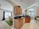 A view from the kitchen into the dining room and living room, with an open layout at 3075 Barbados Ln, Haines City, FL 33844