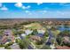 Exceptional aerial shot features home near lake and golf course in a gated community at 167 Bell Tower Xing W, Poinciana, FL 34759