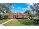 Inviting single-story home showcases mature landscaping and an expansive lawn at 167 Bell Tower Xing W, Poinciana, FL 34759