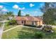 Charming single-story home featuring lush landscaping, well-manicured lawn and brick walkway leading to the front entrance at 167 Bell Tower Xing W, Poinciana, FL 34759