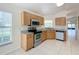 Kitchen with stainless steel appliances, granite countertops and lots of natural light at 167 Bell Tower Xing W, Poinciana, FL 34759