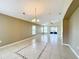 Bright and airy living room area with large windows and sliding doors that provide ample natural light and tile flooring at 167 Bell Tower Xing W, Poinciana, FL 34759
