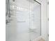 Modern shower with glass doors and a built-in seat, perfect for relaxation and convenience, with tile surround at 167 Bell Tower Xing W, Poinciana, FL 34759