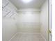 Spacious walk-in closet with shelving, providing ample storage space for an organized and clutter-free lifestyle at 167 Bell Tower Xing W, Poinciana, FL 34759