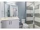 Modern bathroom with a walk-in shower and white vanity at 1735 Oak Blossom Dr, Davenport, FL 33837