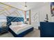 Elegant bedroom with a blue velvet headboard and gold accents at 1735 Oak Blossom Dr, Davenport, FL 33837