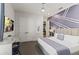King-size bed, stylish decor, and a purple accent wall at 1735 Oak Blossom Dr, Davenport, FL 33837