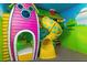 Whimsical ' bedroom with Minnie Mouse theme and slide at 1735 Oak Blossom Dr, Davenport, FL 33837