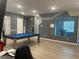 Game room boasts a pool table, home gym, and a fun, modern design at 1735 Oak Blossom Dr, Davenport, FL 33837