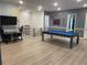 Spacious game room with pool table, large screen TV, and gaming area at 1735 Oak Blossom Dr, Davenport, FL 33837