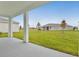 Spacious backyard with covered patio and grassy lawn at 2918 Sharp Rd, Kissimmee, FL 34744
