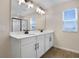 Double vanity bathroom with large mirror and separate shower at 2918 Sharp Rd, Kissimmee, FL 34744