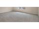 Spacious bedroom with neutral walls and grey carpet at 2918 Sharp Rd, Kissimmee, FL 34744