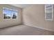 Spacious bedroom with carpeted floor and large window at 2918 Sharp Rd, Kissimmee, FL 34744