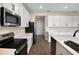 Open concept kitchen with white cabinets and an island at 2918 Sharp Rd, Kissimmee, FL 34744