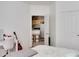 Cozy bedroom featuring natural light, desk and chair for a workstation, and doorway to the kitchen at 1100 Lake Shadow Cir # 2101, Maitland, FL 32751