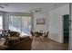 A brightly lit dining room next to a living room provides plenty of seating space at 1100 Lake Shadow Cir # 2101, Maitland, FL 32751