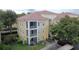 Beautiful condo building featuring a well-maintained exterior and a tile roof at 1100 Lake Shadow Cir # 2101, Maitland, FL 32751