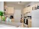 Well-lit kitchen with ample counter space and all white appliances at 1100 Lake Shadow Cir # 2101, Maitland, FL 32751