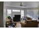 Bright living room featuring comfortable seating, a ceiling fan and large window offering natural light at 1100 Lake Shadow Cir # 2101, Maitland, FL 32751