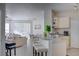 Cozy living room features an open floor plan with kitchen breakfast bar and lots of natural light at 1100 Lake Shadow Cir # 2101, Maitland, FL 32751