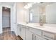 Spacious main bathroom featuring double sinks, a glass shower, and a large mirror at 636 Hennepin Loop, Lake Wales, FL 33898