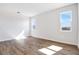 Bright living room featuring tile floors and three windows providing natural light at 636 Hennepin Loop, Lake Wales, FL 33898