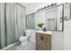 Well-lit bathroom featuring a vanity with storage and decorative floor tiles at 1404 Longville Cir, Tavares, FL 32778