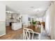 The dining room showcases an open layout, connecting to the kitchen and living spaces, creating an ideal entertaining area at 1404 Longville Cir, Tavares, FL 32778