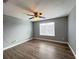 Well-lit bedroom featuring wood-look floors and a ceiling fan at 14642 Yellow Butterfly Rd, Windermere, FL 34786