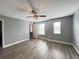 Spacious bedroom with wood-look flooring and ceiling fan at 14642 Yellow Butterfly Rd, Windermere, FL 34786