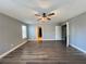 Spacious bedroom with wood-look floors and ceiling fan at 14642 Yellow Butterfly Rd, Windermere, FL 34786