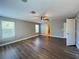 Bright bedroom with wood-look floors and an ensuite bathroom at 14642 Yellow Butterfly Rd, Windermere, FL 34786