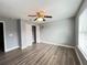 Spacious bedroom with wood-look flooring and ceiling fan at 14642 Yellow Butterfly Rd, Windermere, FL 34786