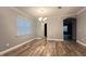 Dining room with wood-look floors and access to kitchen at 14642 Yellow Butterfly Rd, Windermere, FL 34786