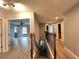 Upstairs hallway offering views of bedrooms and staircase at 14642 Yellow Butterfly Rd, Windermere, FL 34786