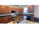 Modern kitchen with granite countertops and wood cabinets at 14642 Yellow Butterfly Rd, Windermere, FL 34786