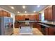 Modern kitchen with granite countertops and wood cabinets at 14642 Yellow Butterfly Rd, Windermere, FL 34786