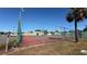 Community tennis courts with chain link fence at 225 E Pomelo St, Lake Alfred, FL 33850