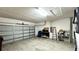 Attached garage with ample space for storage and workshop area at 325 Ashley Loop, Davenport, FL 33837