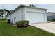 White garage with a side view showcasing a spacious design at 325 Ashley Loop, Davenport, FL 33837