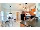 Kitchen with wood cabinets, black countertops, and breakfast nook at 325 Ashley Loop, Davenport, FL 33837