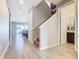 Bright hallway with tile floors and staircase at 592 Lake Smart Blvd, Winter Haven, FL 33881